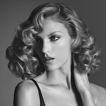 Styling the hair with a hair dryer, tongs and iron steam-pod stylers